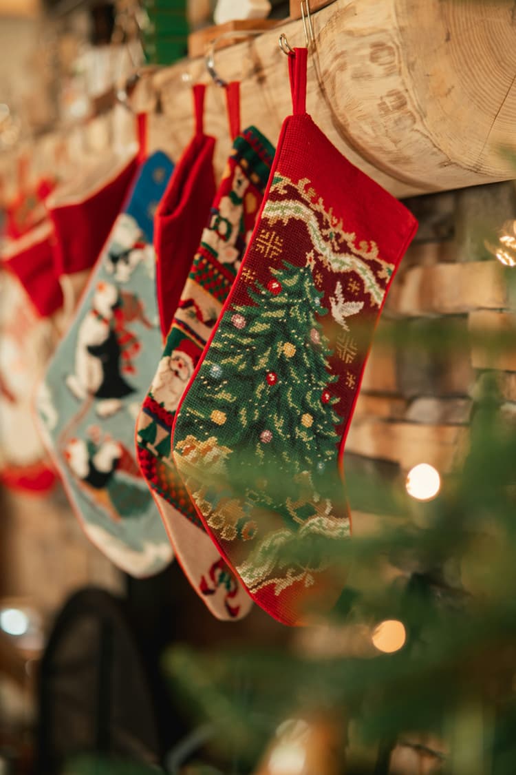 Christmas stockings hanging from a rack on a wall