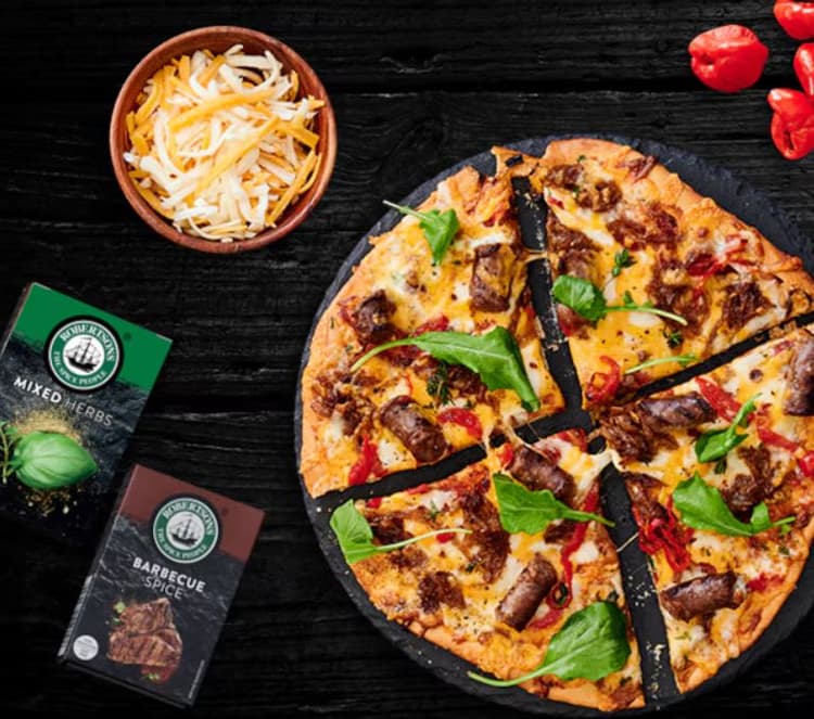 A pizza sitting on top of a wooden table