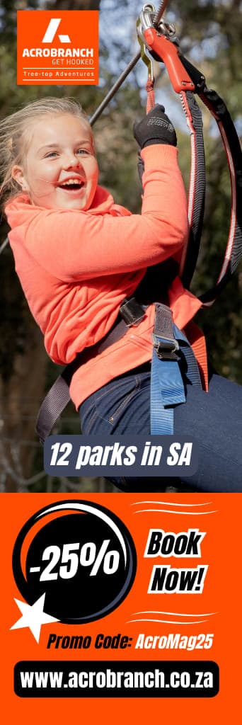 A woman riding on the back of a zip line