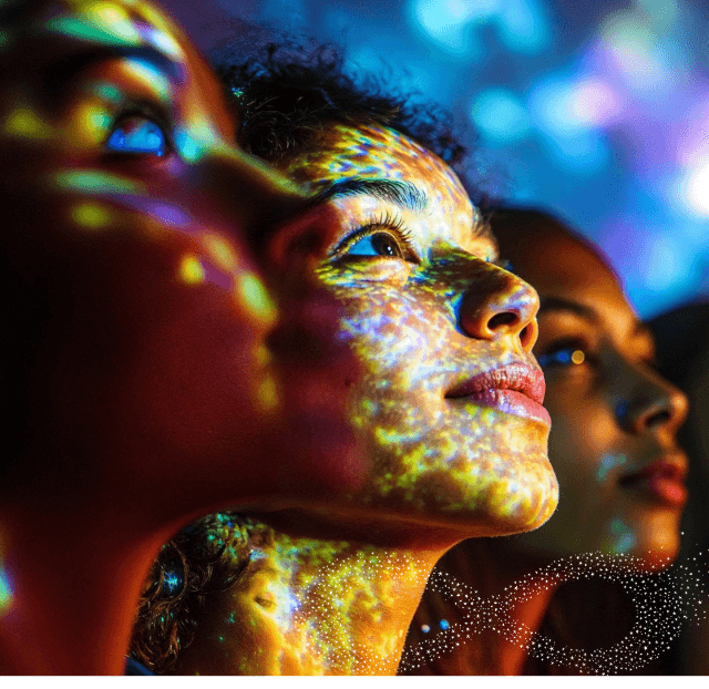 A group of people with colored powder on their faces