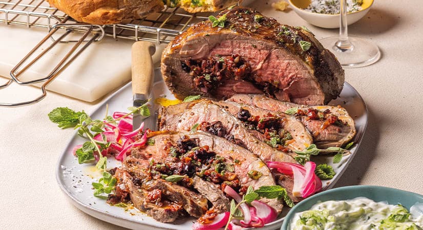 A plate of meat and vegetables on a table