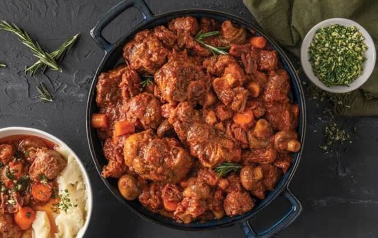 Meatballs and mashed potatoes in a skillet