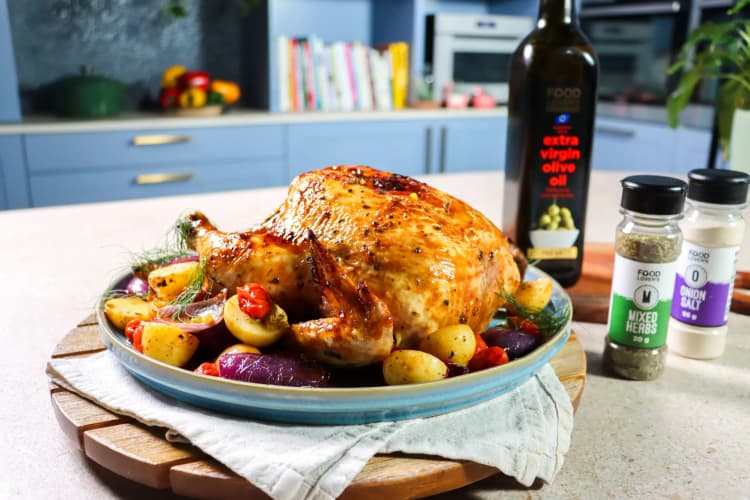 A plate of food on a table with a bottle of wine