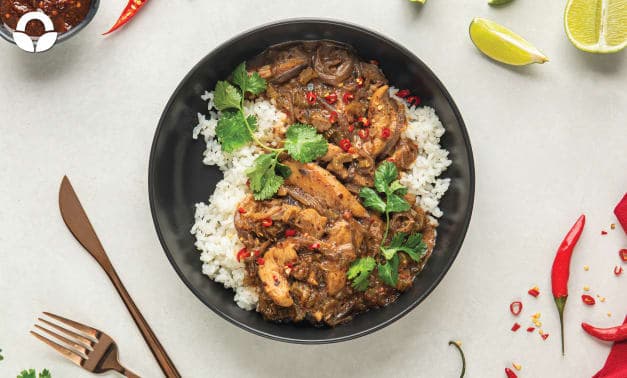 A black bowl filled with rice and meat