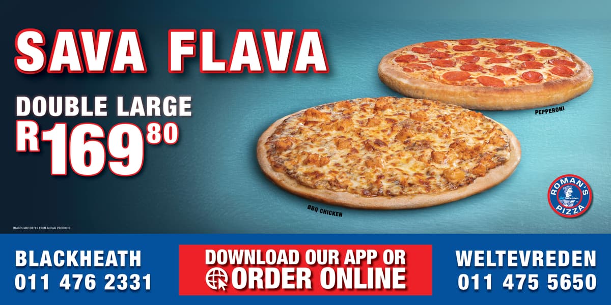 A couple of pizzas sitting on top of a table