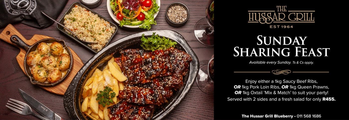 A table topped with lots of food next to a knife and fork